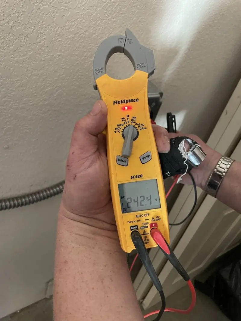 Voltage testing with clamp meter during Generator Installation in Forestville